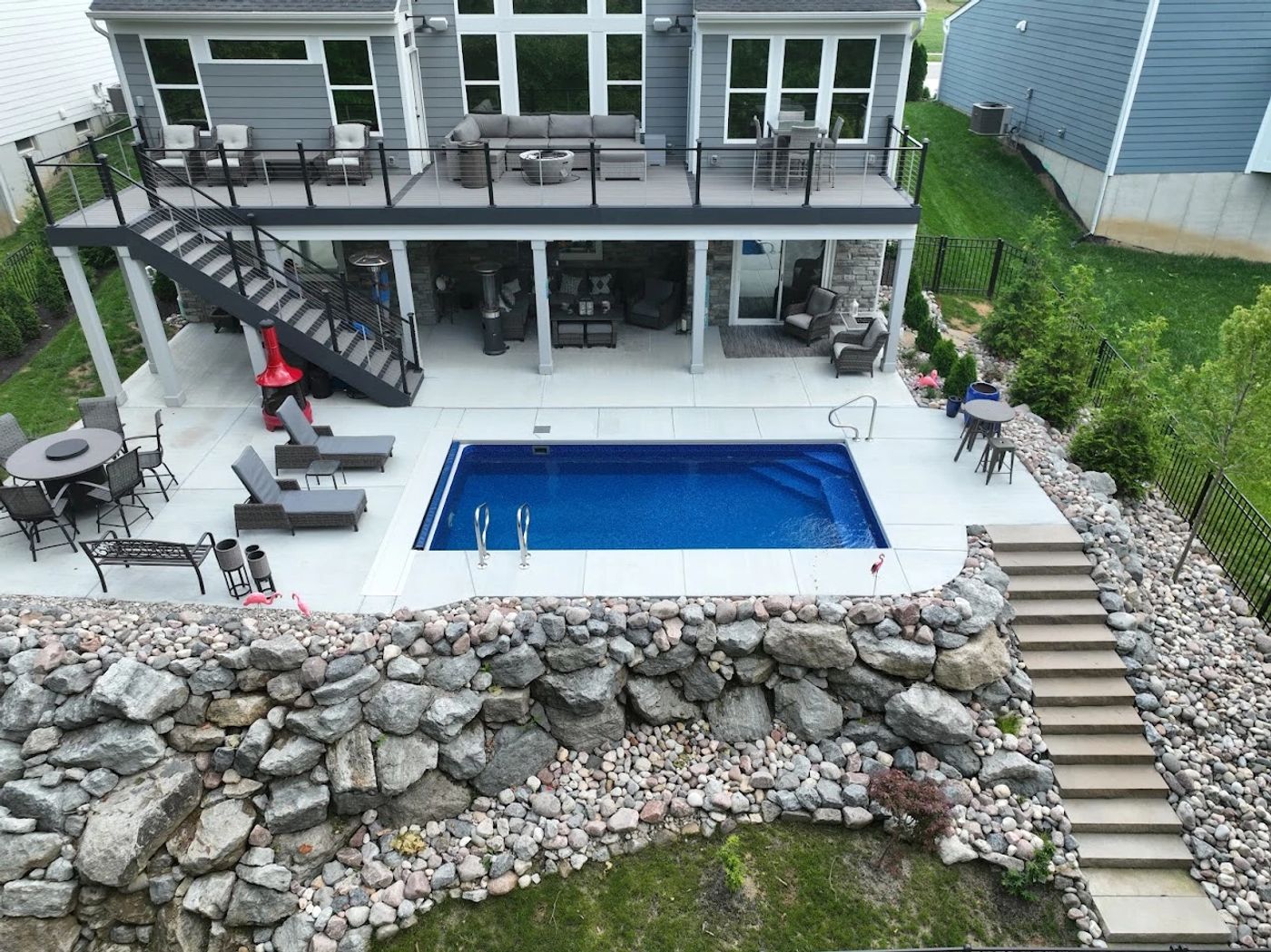 small lap vinyl liner pool in sloped backyard