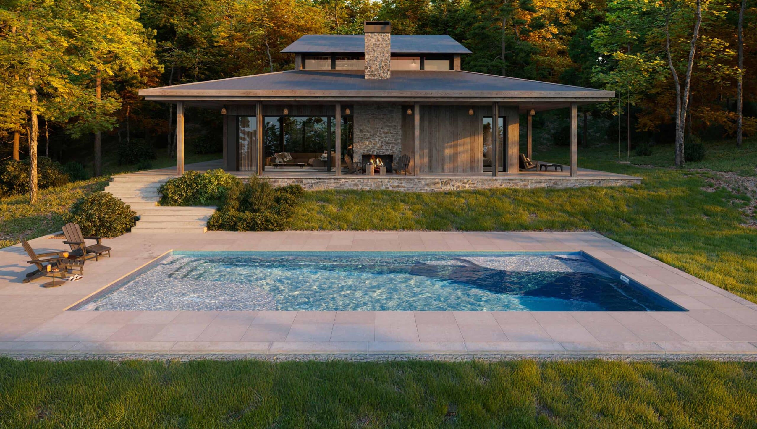 Newest inground pool shown in a landscaped backyard with a pool house.
