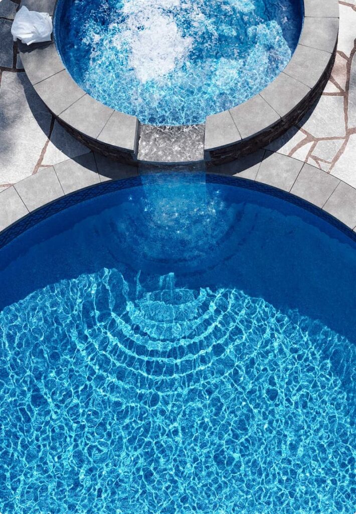 Overview of spa overflowing into inground pool