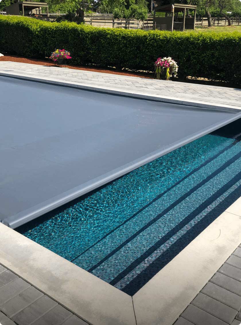 automatic inground pool safety cover covering vinyl liner pool