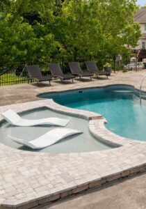 Tanning ledge in a pool under sunny skies.